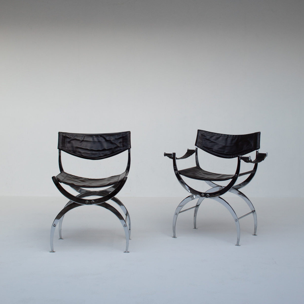 Set of 6 Italian Chrome Dining Chairs with Leather Seating — rear view highlighting black leather and chrome frame