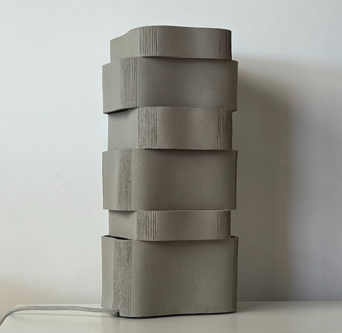 Too 60-2 Table Lamps in Ceramic and Stoneware — side angle showing stacked gray ceramic design
