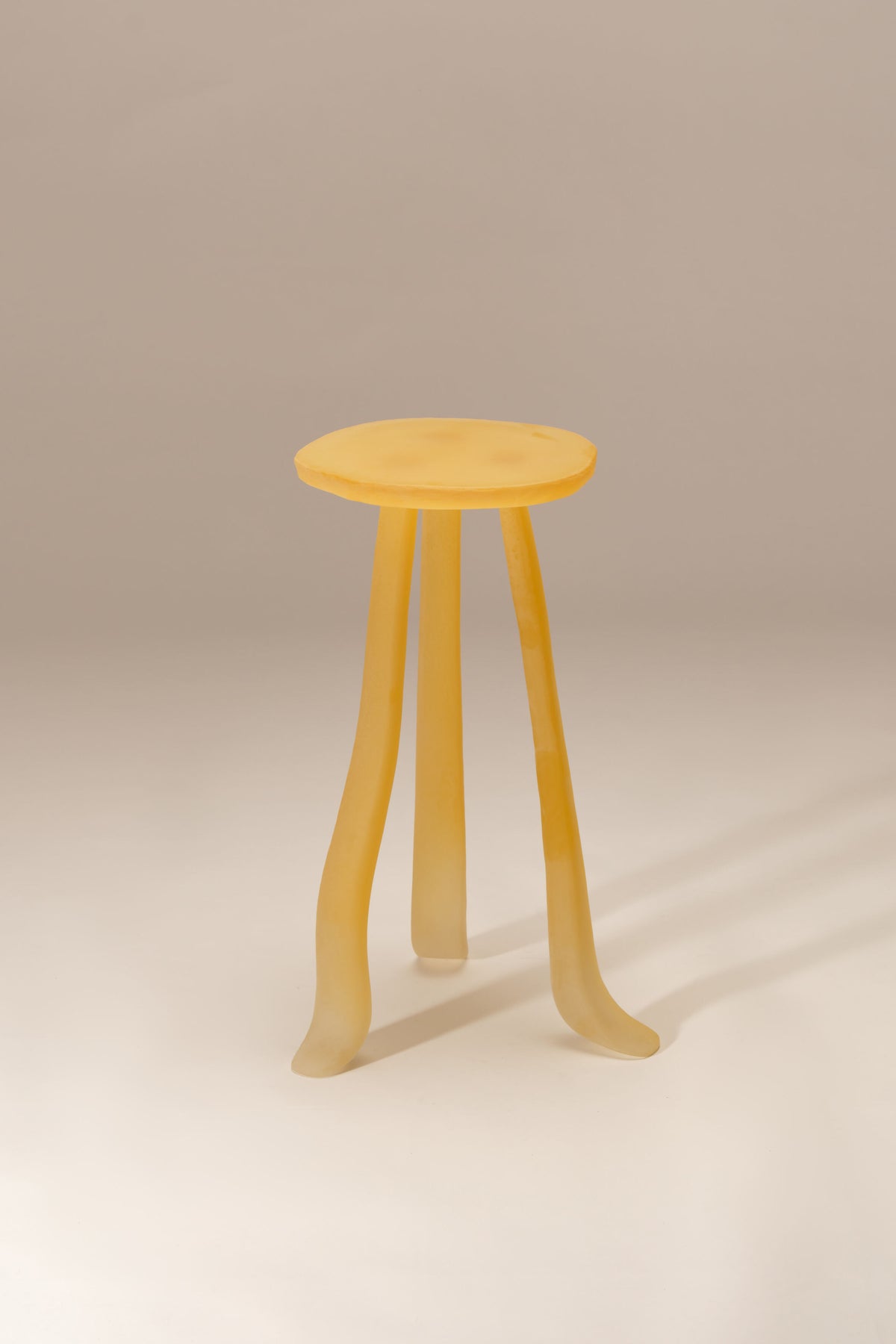Lung 1.0 honey-colored wooden side table with curved legs by Szymon Keller