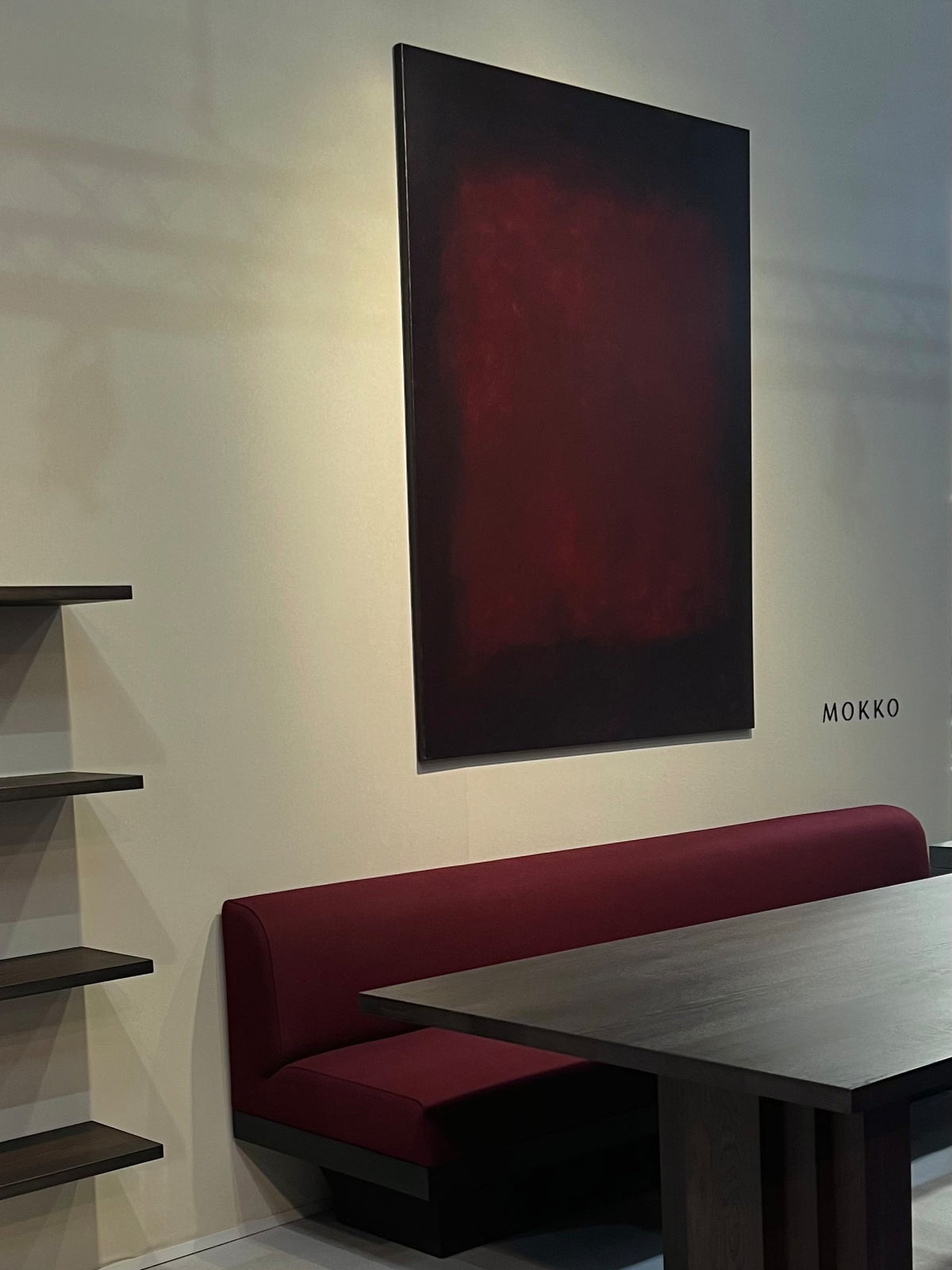 Oil painting by Aimée Adriaansen, Burgundy (2024) — side view above burgundy sofa in modern setting