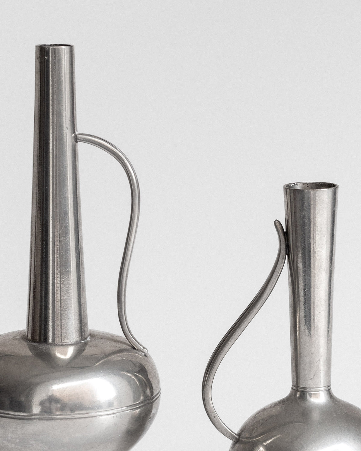 Pair of Pewter Vessels by GAB, Sweden, 1950s — top view highlighting slender necks and handles