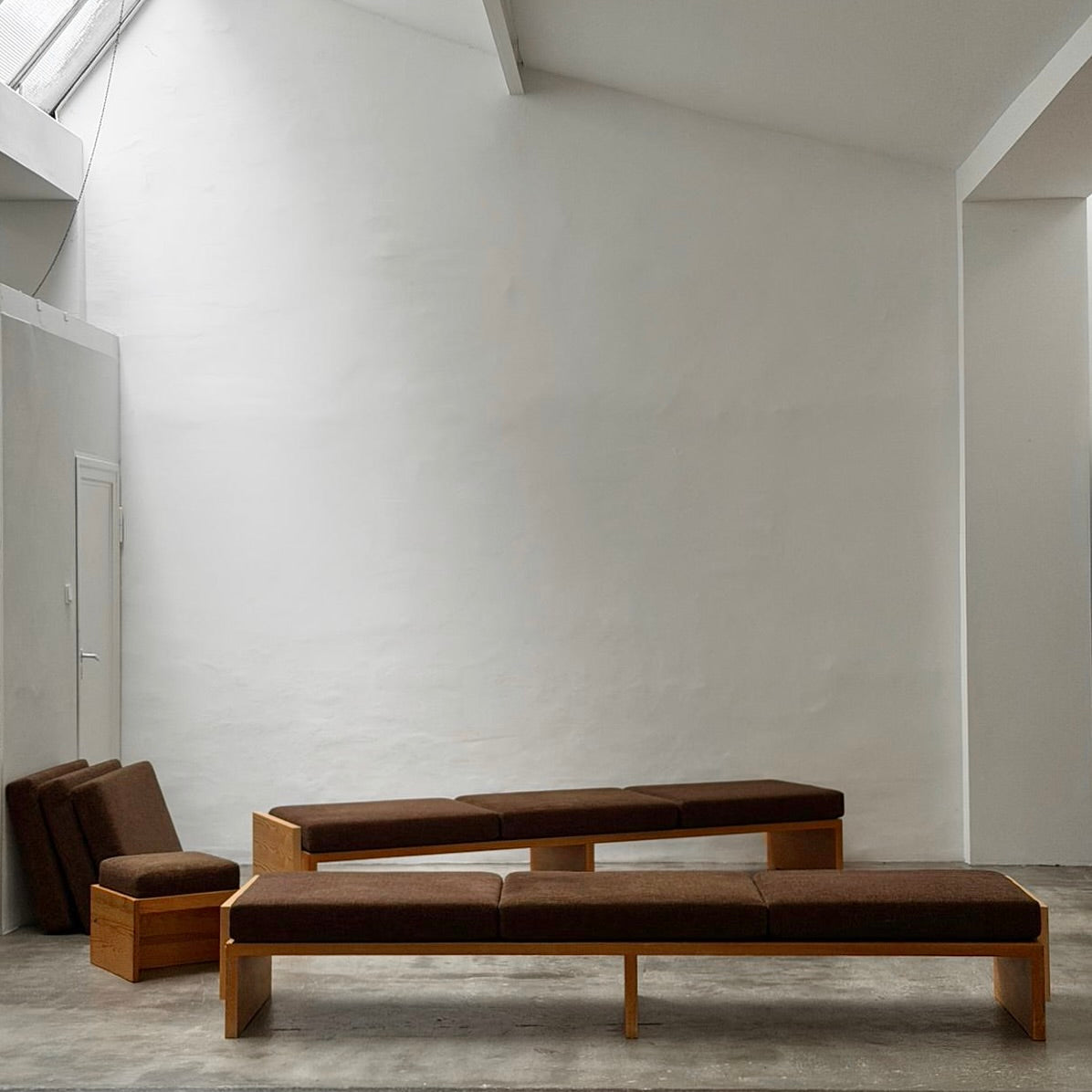 Modernist Benches and Stool, c.1970 — top view of brown upholstered seating