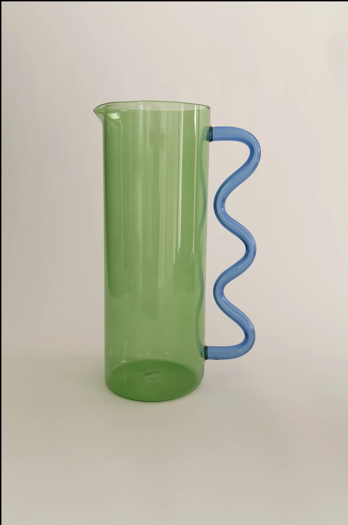 Wave Pitcher — side view highlighting green plastic and blue handle