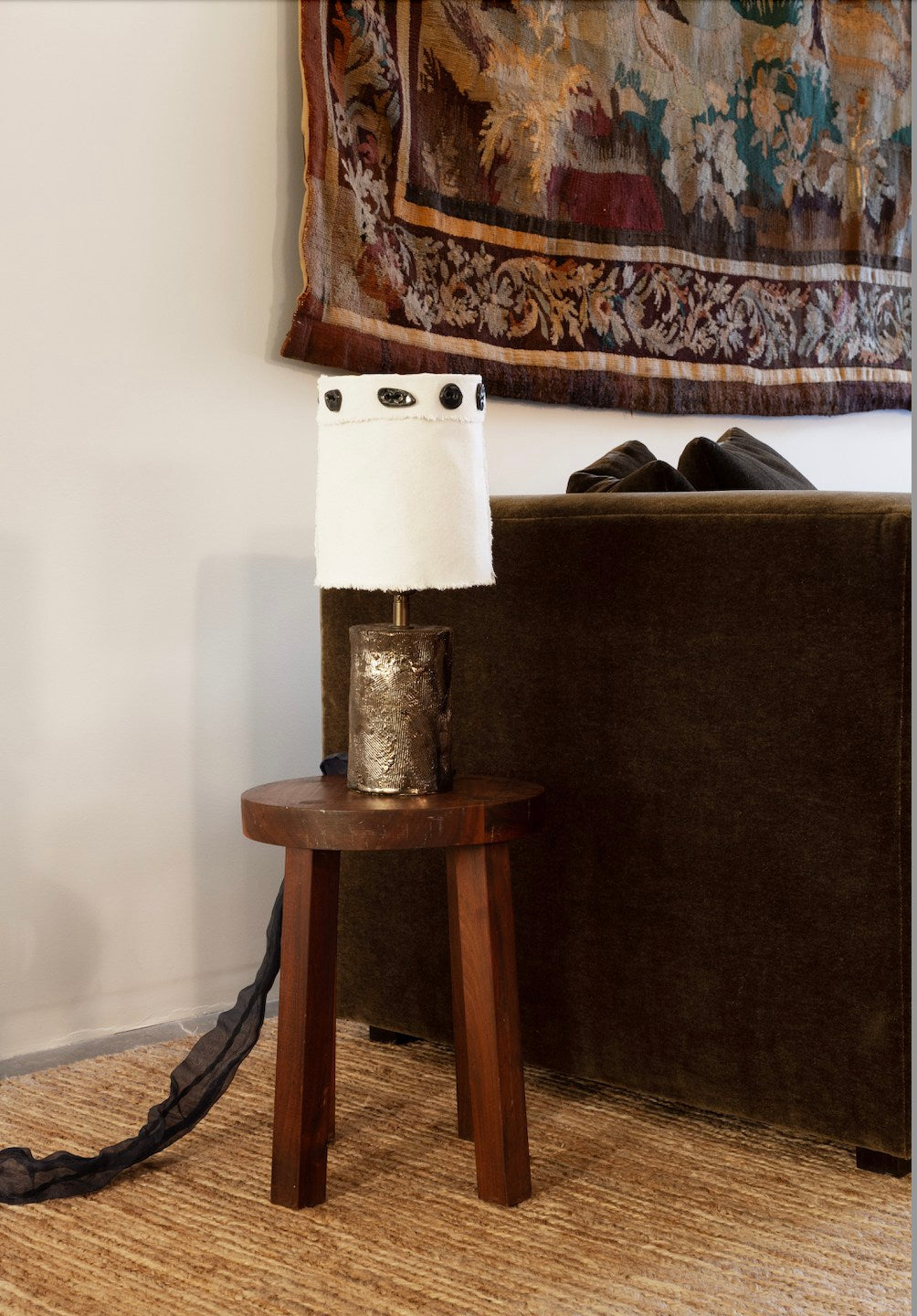 Tender Buttons — side angle of ceramic lamp on wooden table