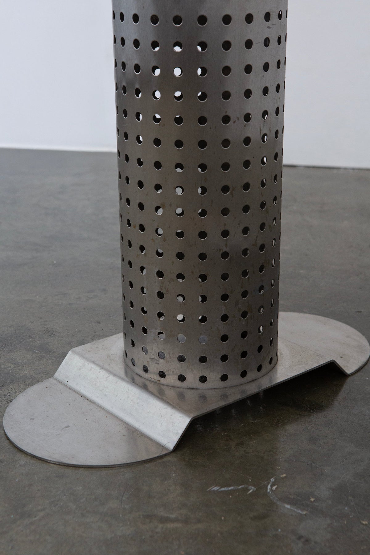 Postmodern Stainless Steel Dining Table, c.1980 — close-up of perforated metal base