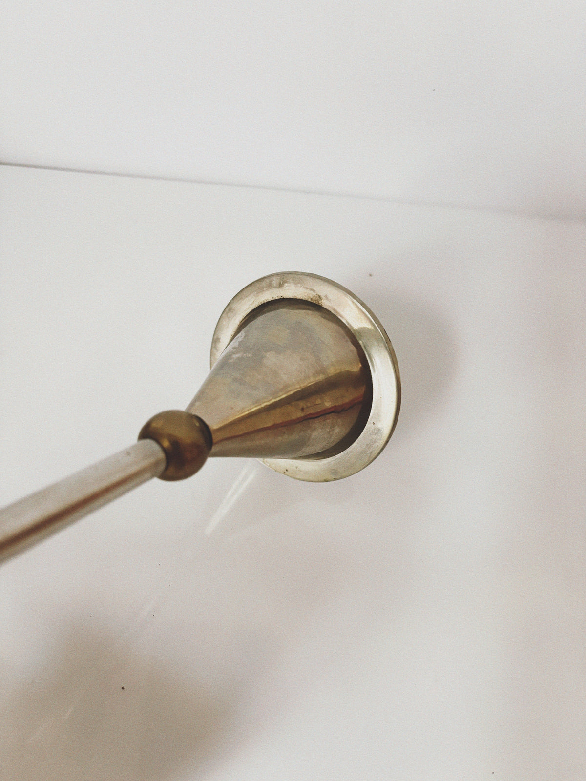 Postmodern Metal and Brass Candleholders — angled view of brass base