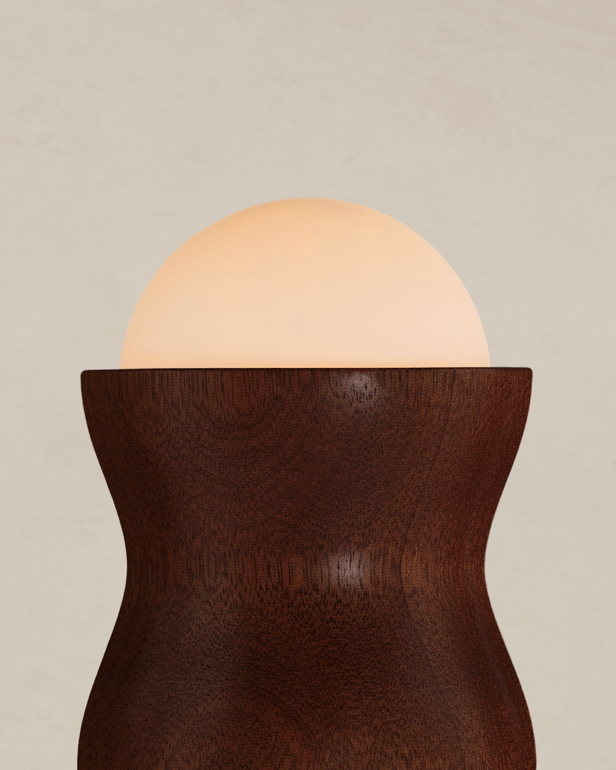 Tougarine Floor lamp — close-up of wooden base with glowing orb