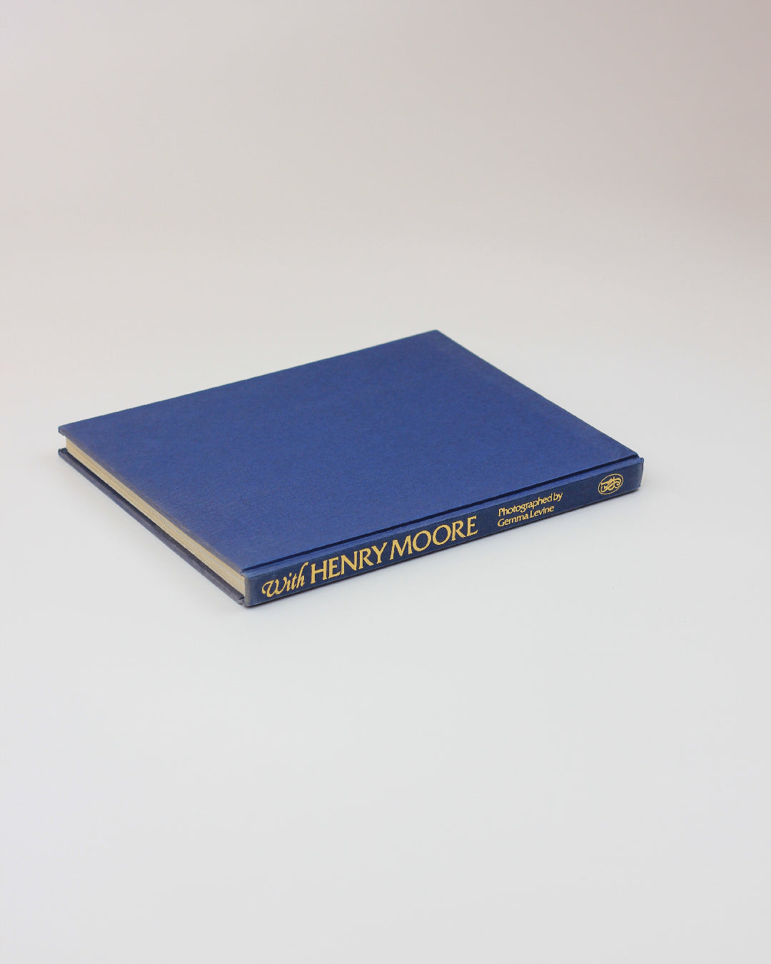 With Henry Moore — top view of blue hardcover book