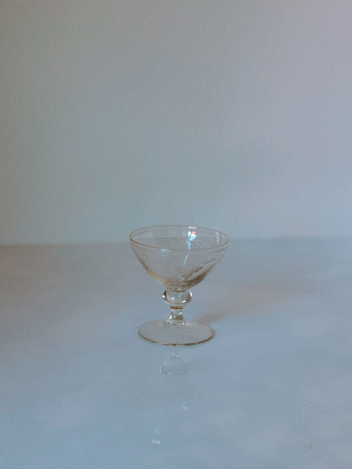 Single etched floral dessert wine glass with decorative stem