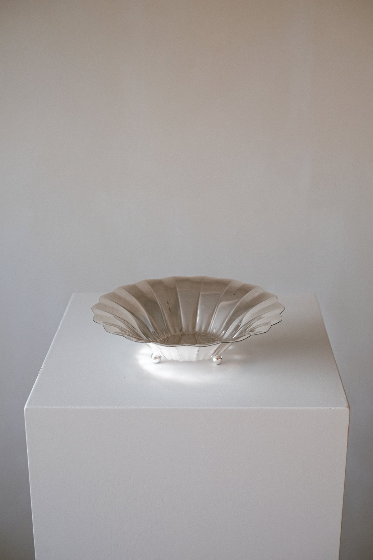 Silver-Plated Footed Bowl — side angle on white pedestal