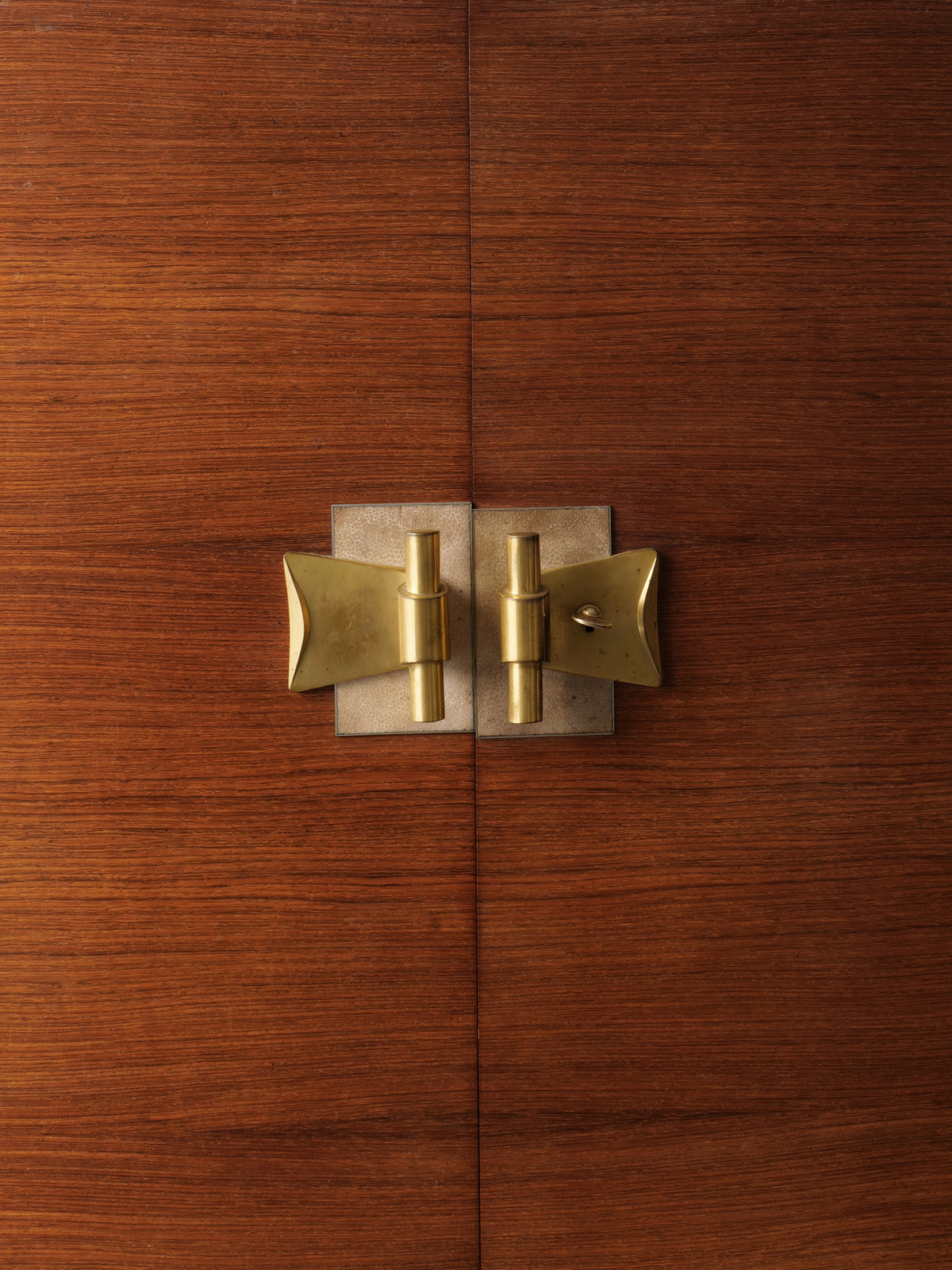 Brass butterfly hinge detail on Jules Leleu 1930 cabinet doors