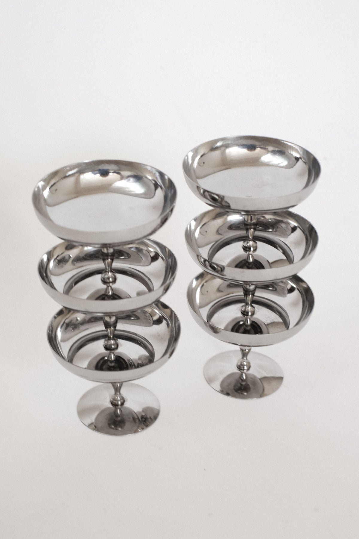 Set of 6 Ice Coupes — side angle showing polished metal finish