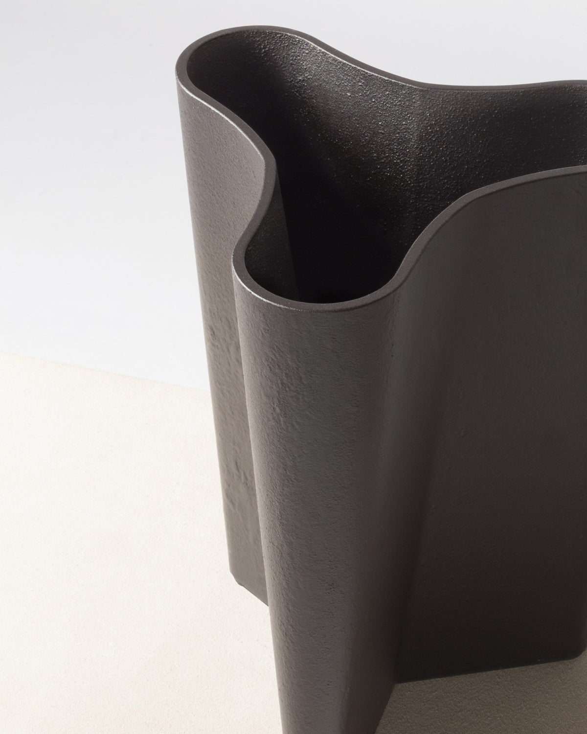 Curved opening detail of Tanell imperfect bronze vase by Giobagnara