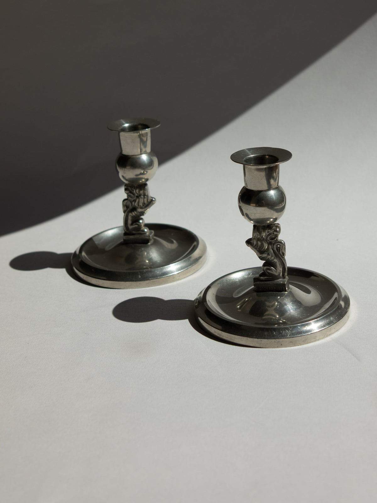 Pair of Swedish Grace Art Deco Pewter Lion Candlesticks by Eskilstuna Metallindustri, 1932 — close-up