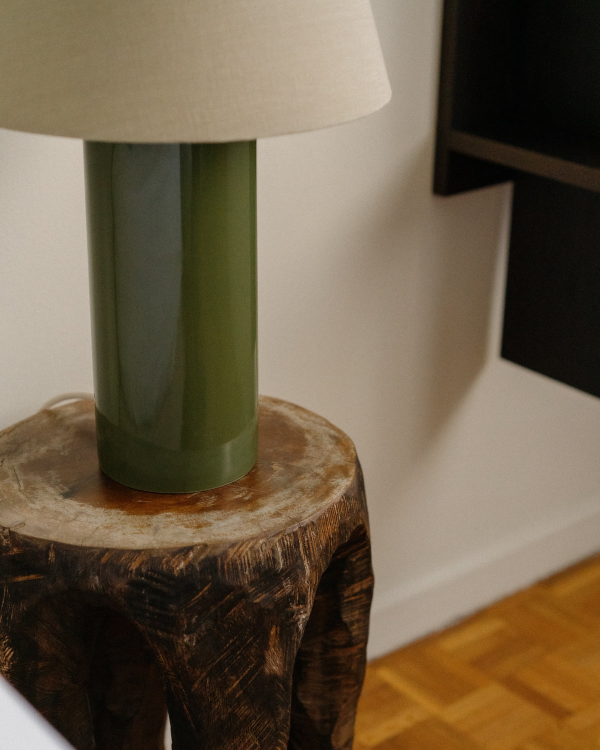 Giro Table Lamp - Treetop & Beige - angled view on wooden side table