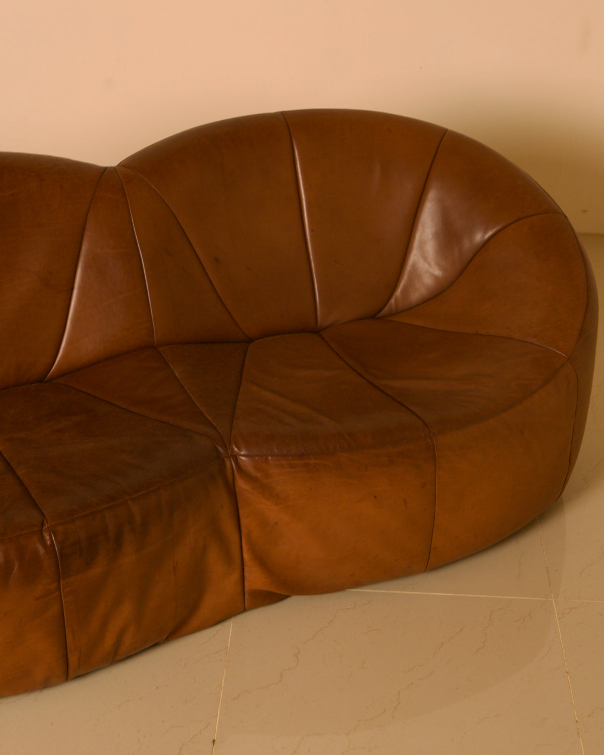 Three-seater "Pumpkin" Sofa by Pierre Paulin for Artifort, 1980 — close-up of brown leather texture