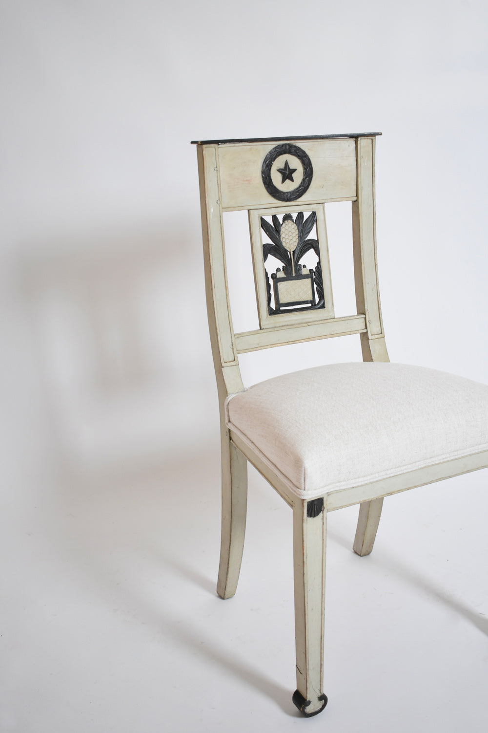 Neoclassical Pineapple Chairs, 1960s — angled view showing cream upholstery and wooden frame