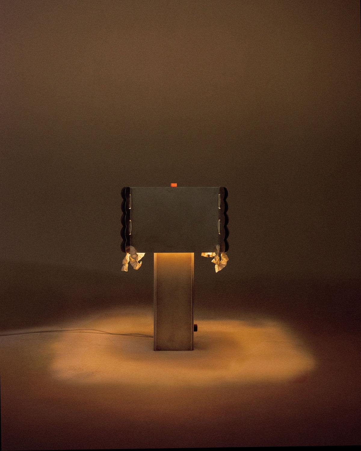 Serwetka table lamp with illuminated base and fabric shade detail