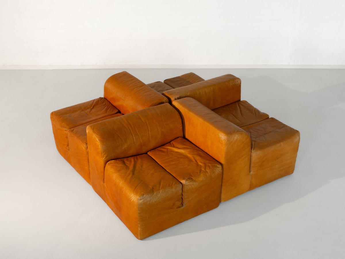 Orange leather modular sofa blocks arranged in cube formation