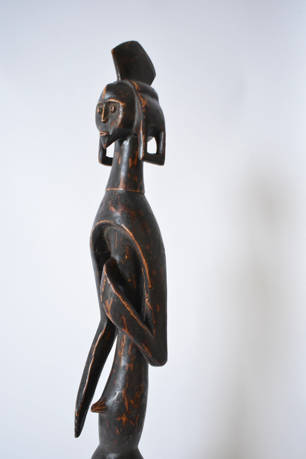 Anthropomorphic African Wooden Sculpture — side view highlighting dark wood finish