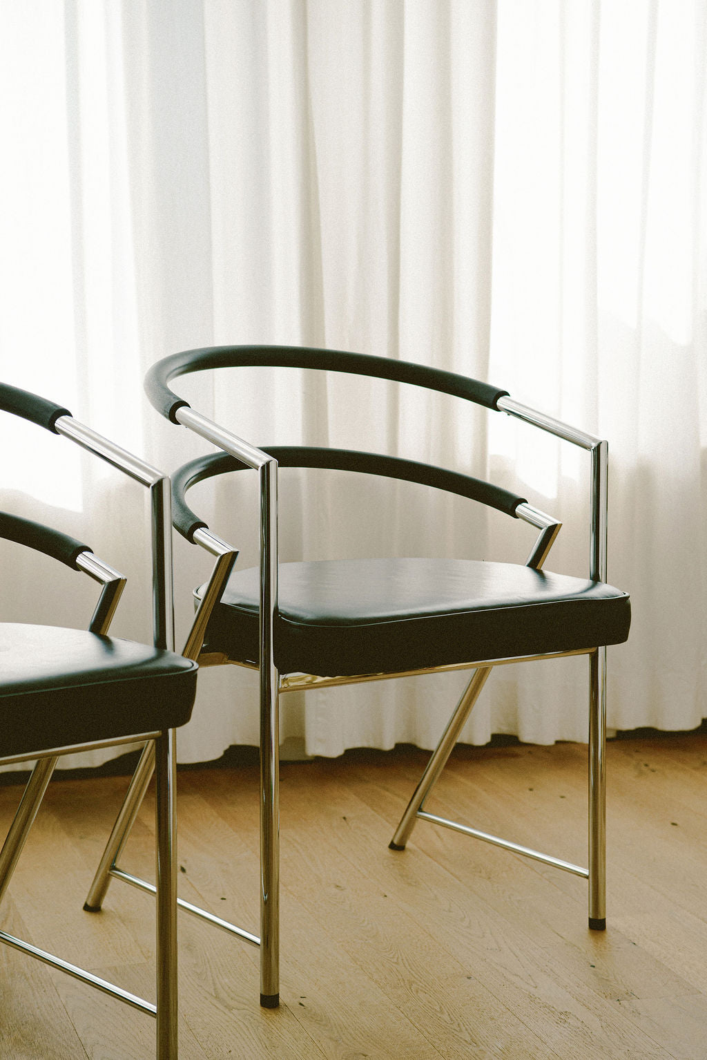 Modernist Chrome Armchair in Leather — close-up of chrome frame and leather seat