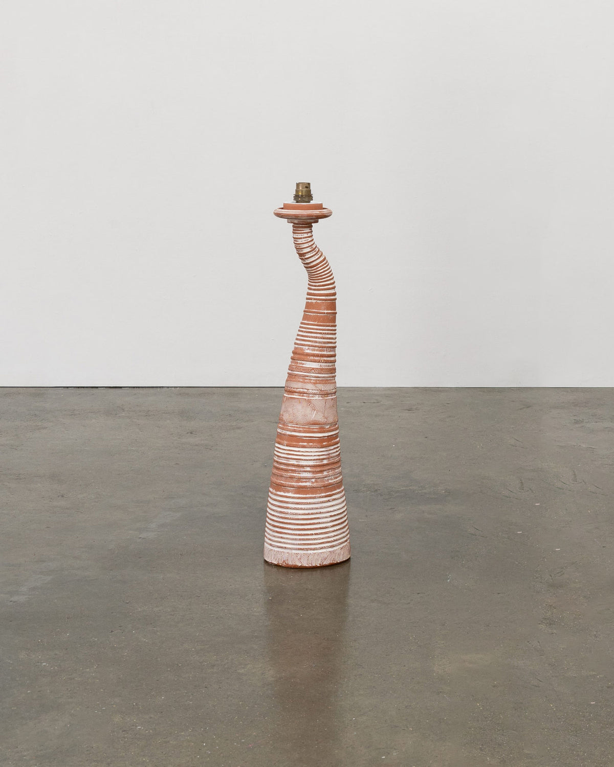 Sculptural terracotta lamp with curved striped design by Tom Bogle