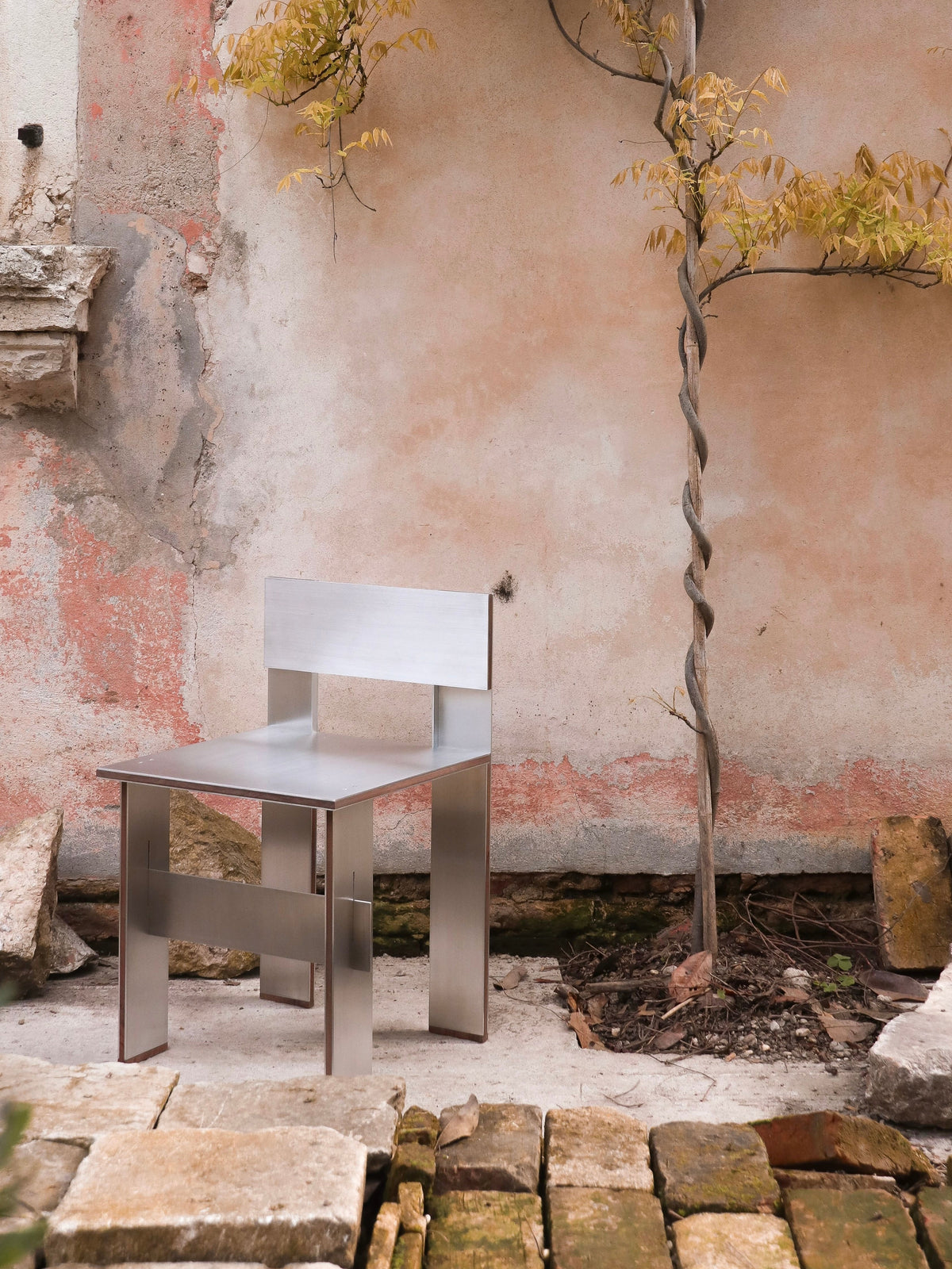 Sandwich Chair — top view of stainless steel seat in outdoor setting