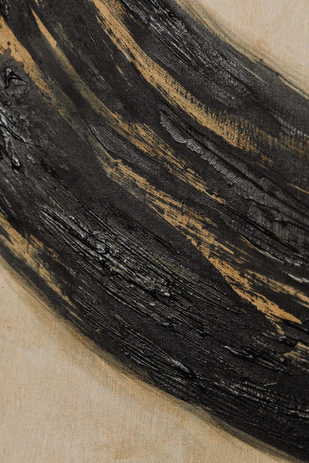 Ensō Acrylic on Linen by Inga Dzintare features a textured black brushstroke on beige linen, inspired by the Ensō symbol, with thick, glossy paint and visible brush marks that evoke deep symbolism.