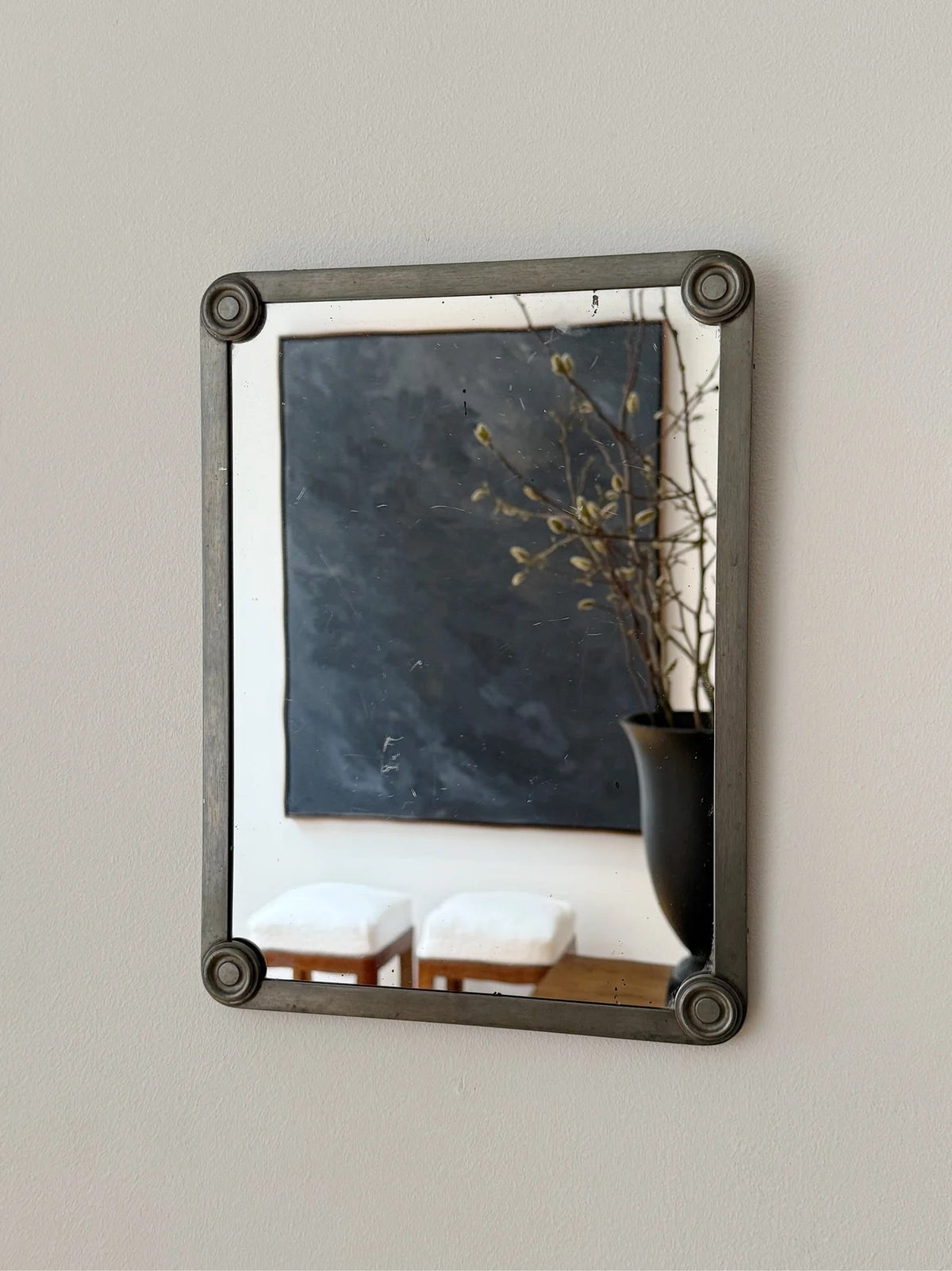 Pewter Mirror, FAK Svenskt Tenn — close-up of mirror frame with wall art