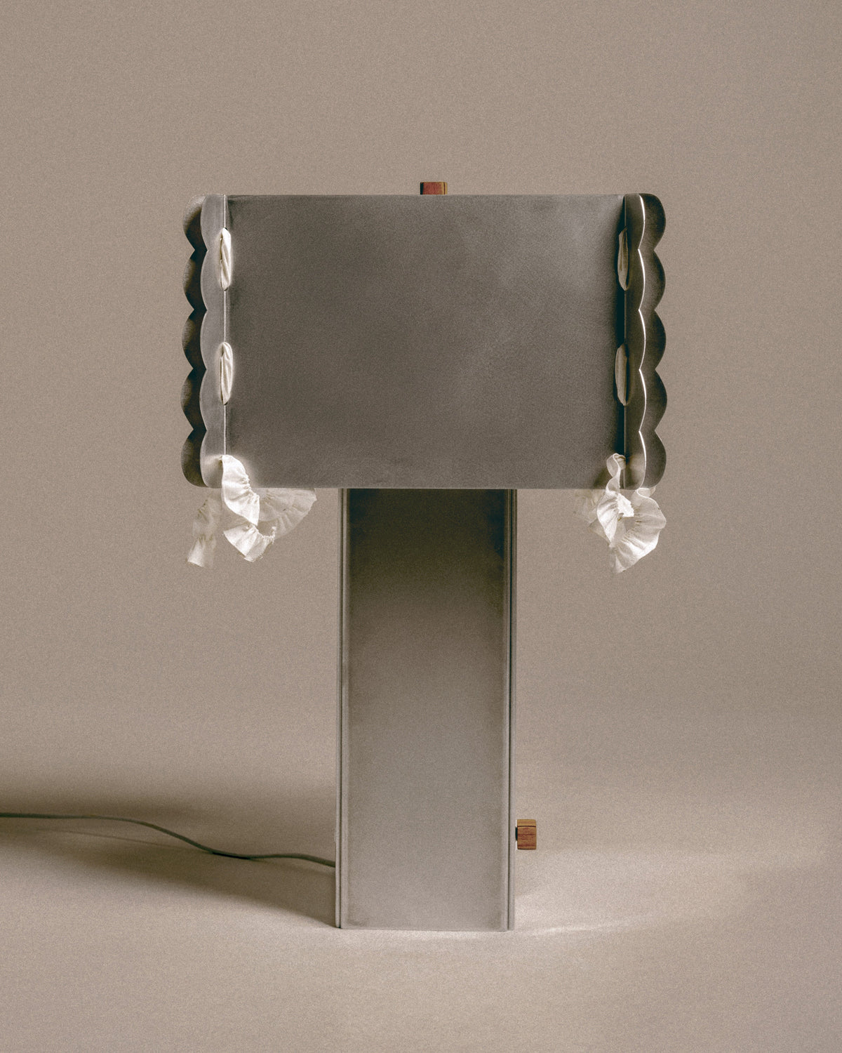 Contemporary Serwetka table lamp with scalloped mirror shade and white ribbons