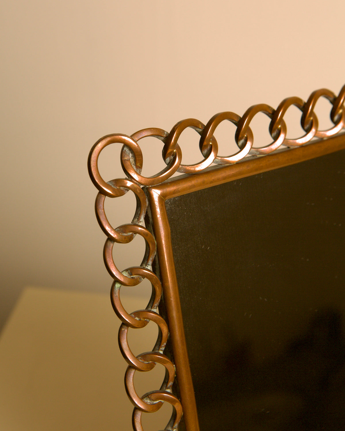 Dutch copper mirror by the Amsterdam School, 1920s — lifestyle setting