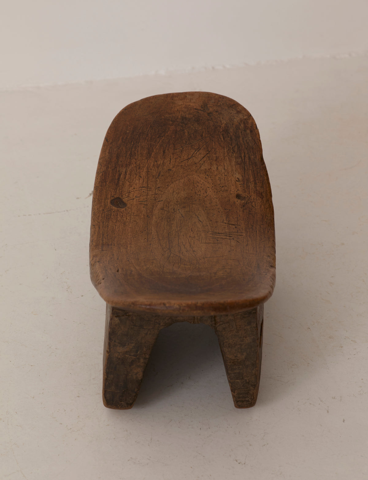 Mid-Century African Senufo Stool in Solid Wood — top view of rustic wooden seat