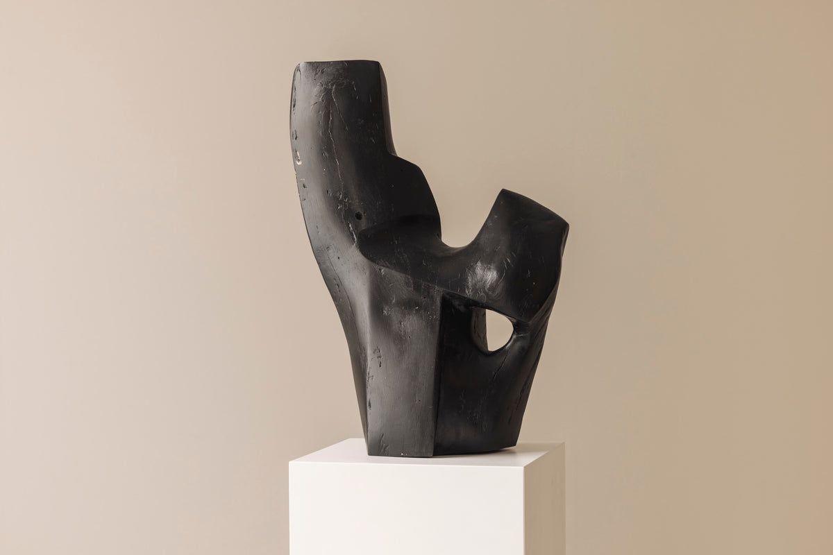 Abstract sculpture in solid dark stained wood dating from the 1950s. by Modern Living | The Oblist