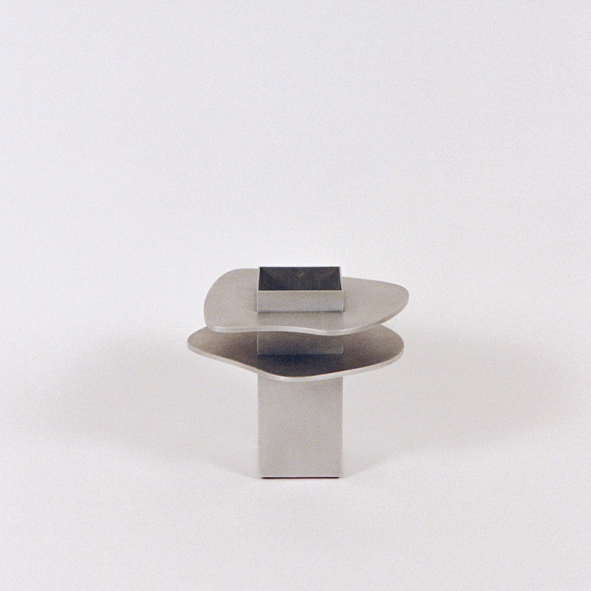 Flange Vase — side angle showing polished metal finish