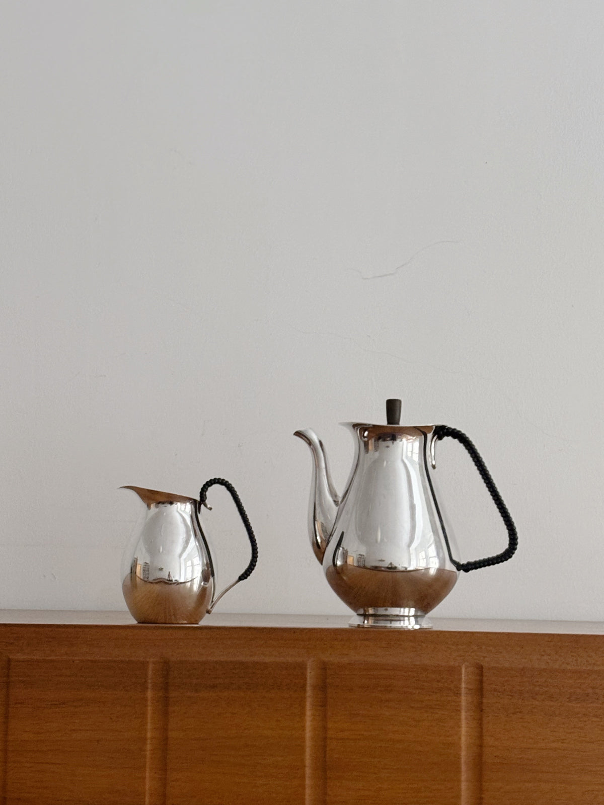 Danish Silver Plated Coffee Set, 2-Piece (c. late 1950s–early 1960s) — close-up of polished silver on wooden surface