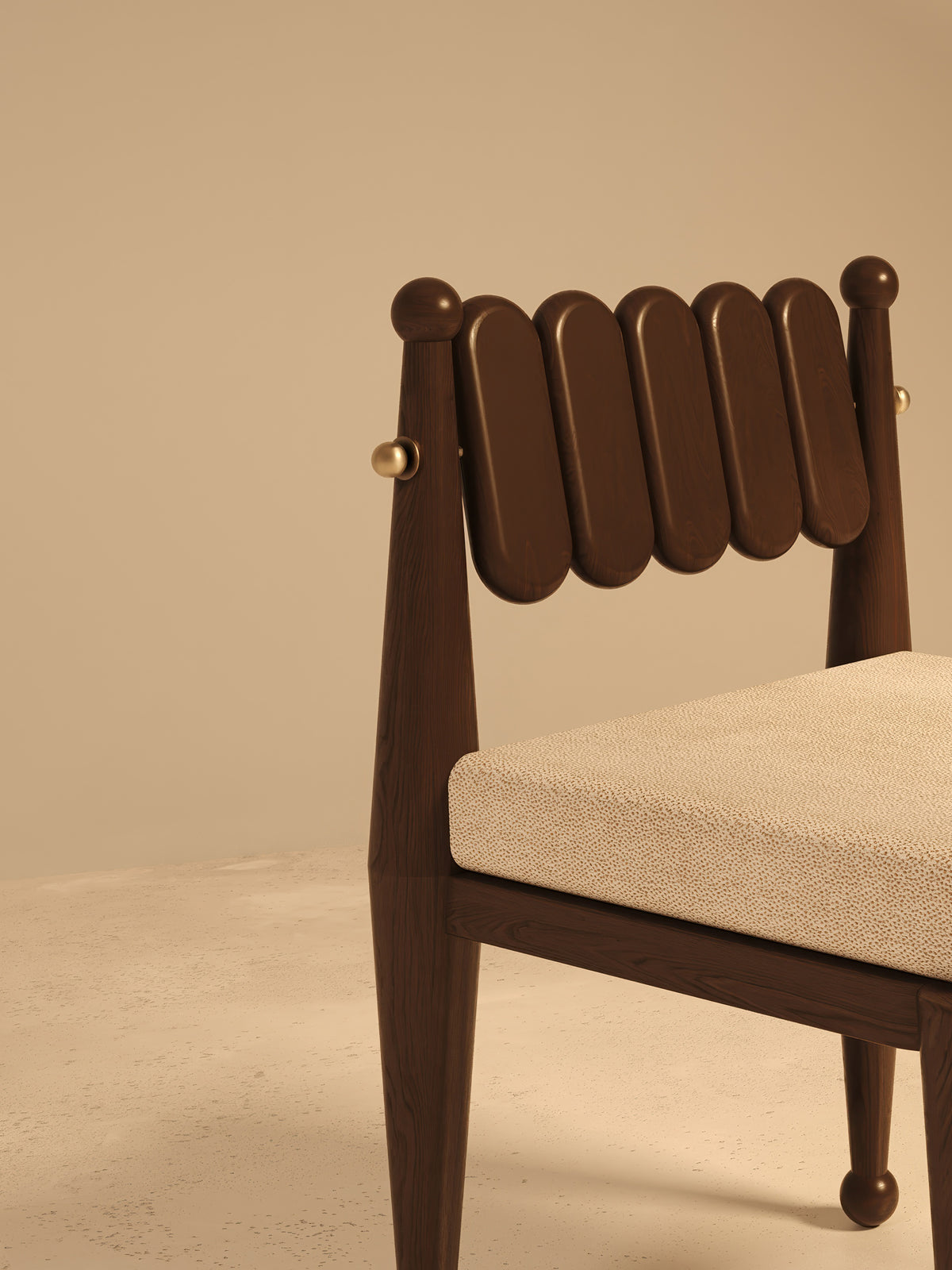 Detail of Simorgh III chair walnut backrest with brass accents
