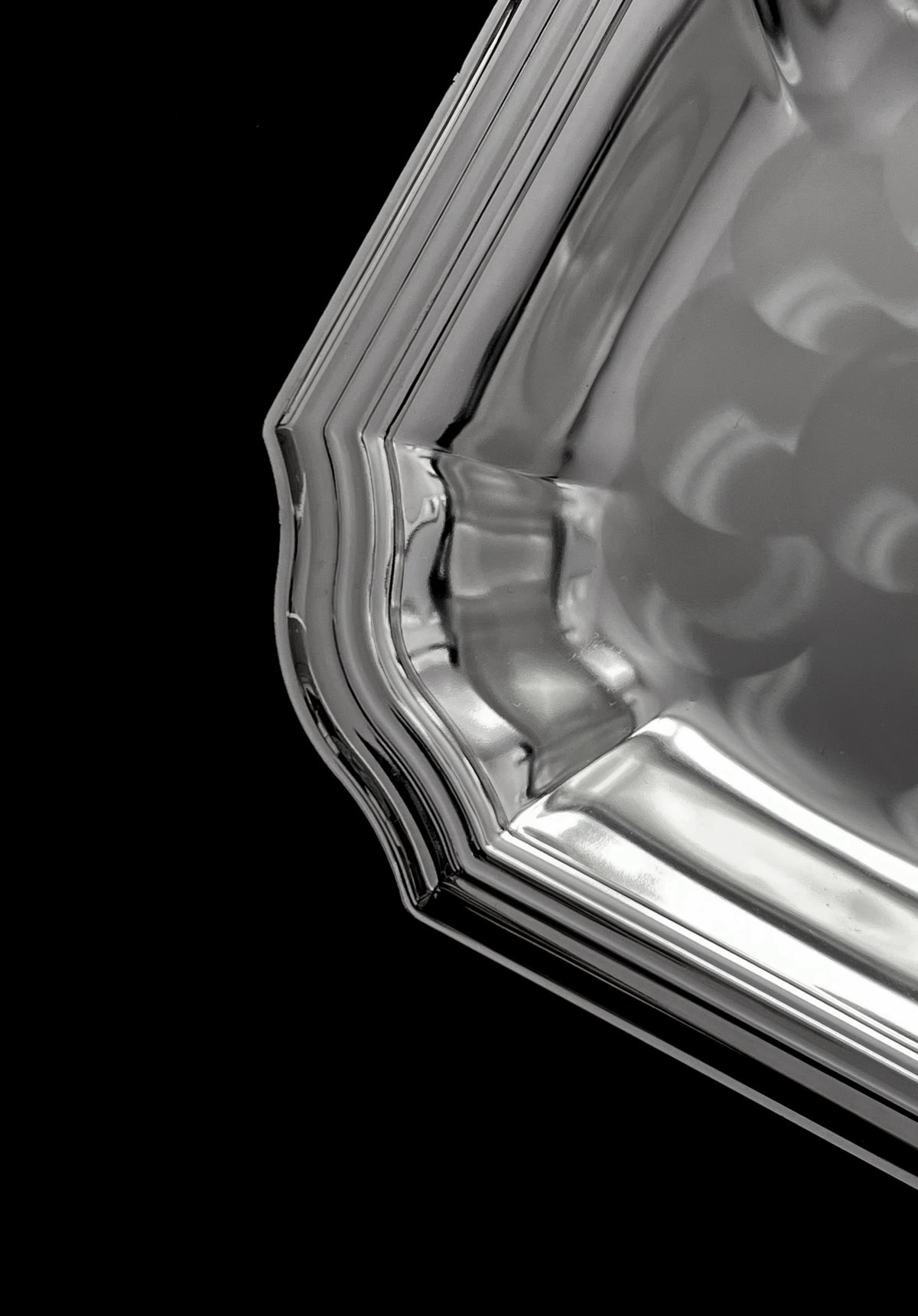 Detailed rim and curved edge of vintage silver-plated dish