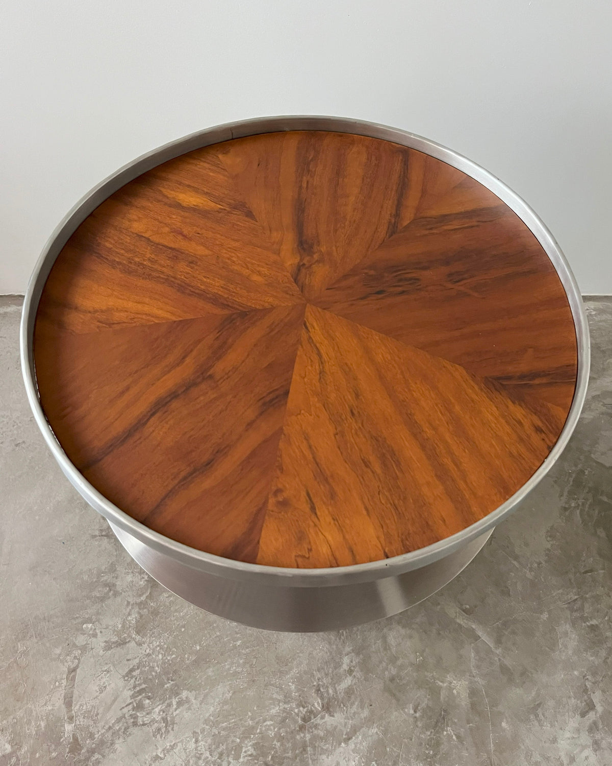 V60 side table featuring radial wood veneer pattern and steel rim