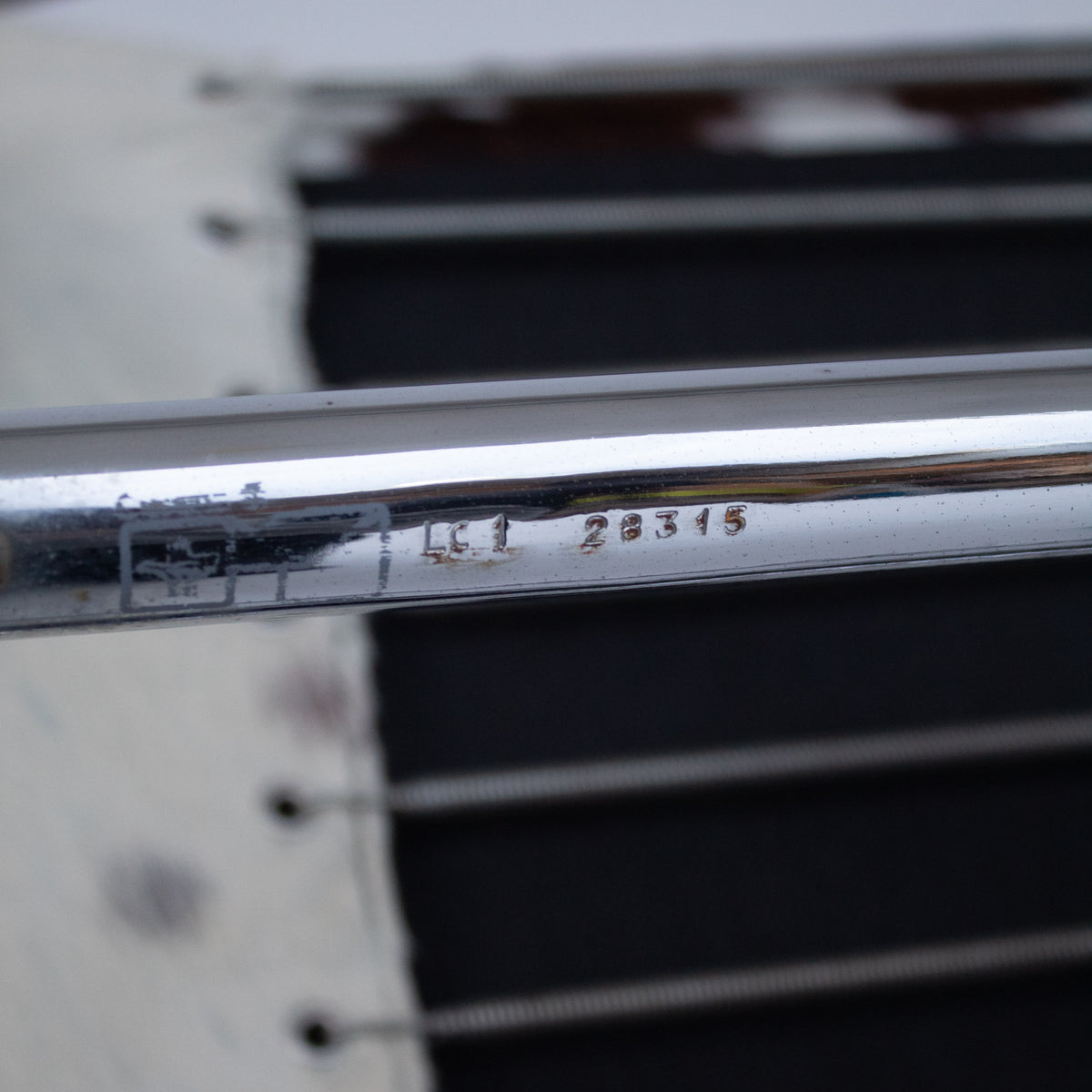 Le Corbusier, Pierre Jeanneret, Charlotte Perriand LC1 Chairs by Cassina — close-up of chrome armrest detail