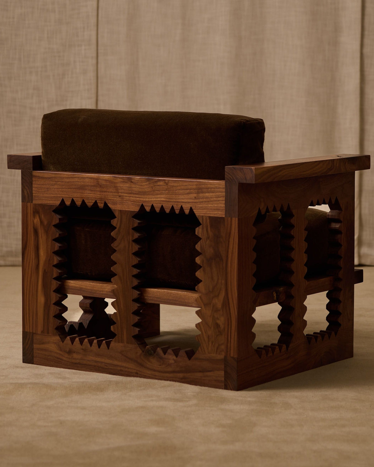Jura club chair wooden geometric base with upholstered seat detail