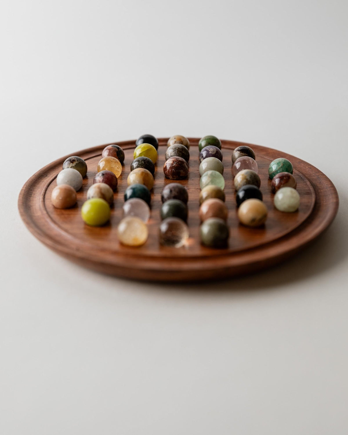 Vintage 1960s Solitaire Board Game, Wooden Game Board with Stone Marbles, Classic Strategy Game, Mid Century Table Game, Timeless Gift Idea — lifestyle setting