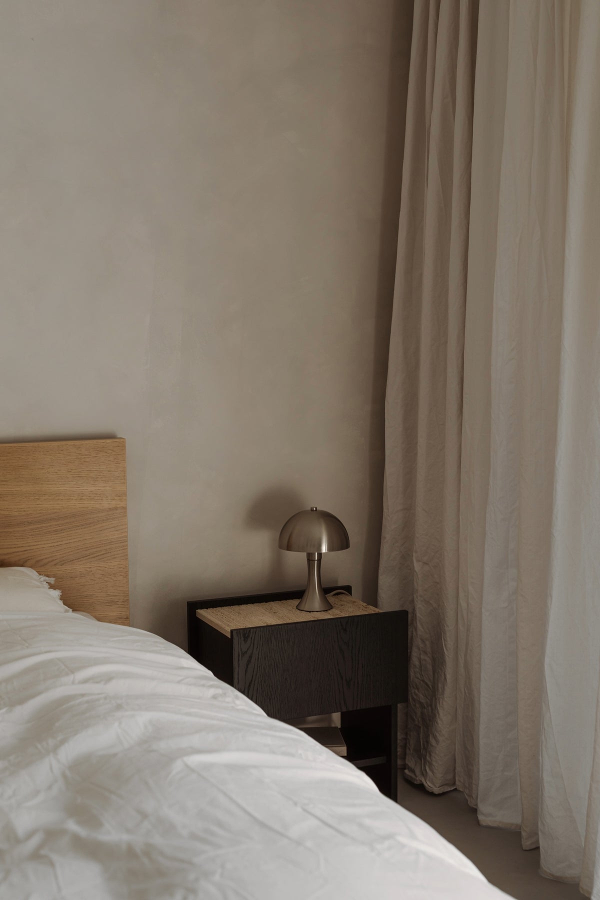 NOTO Night Stand — corner view with wooden top and lamp
