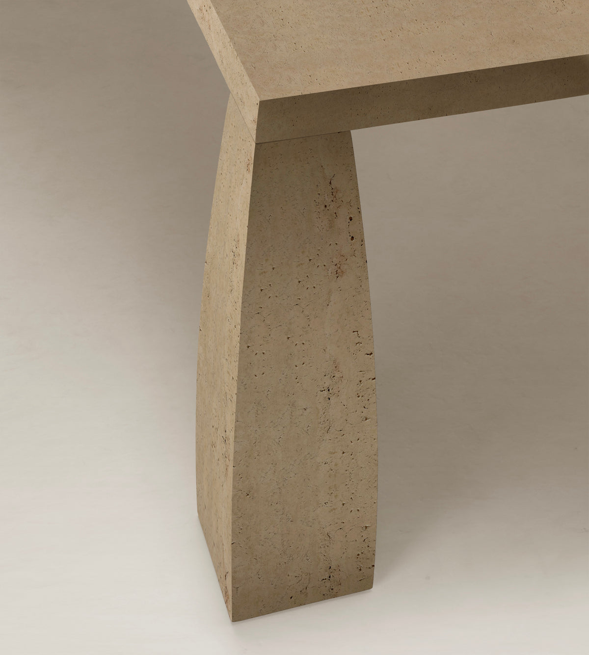 Khram Dining Table — back view of textured stone leg