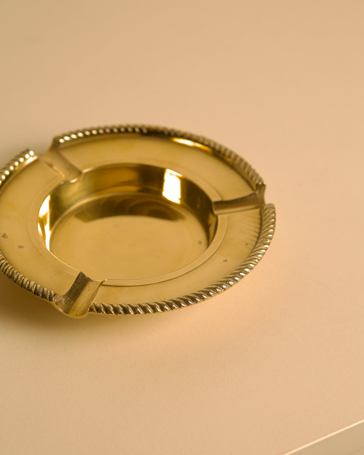 Italian Brass Ashtray DLG Jean Després 60's — close-up of polished brass surface