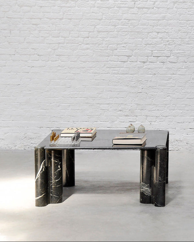 Black marble coffee table with glass top styled after Gae Aulenti design