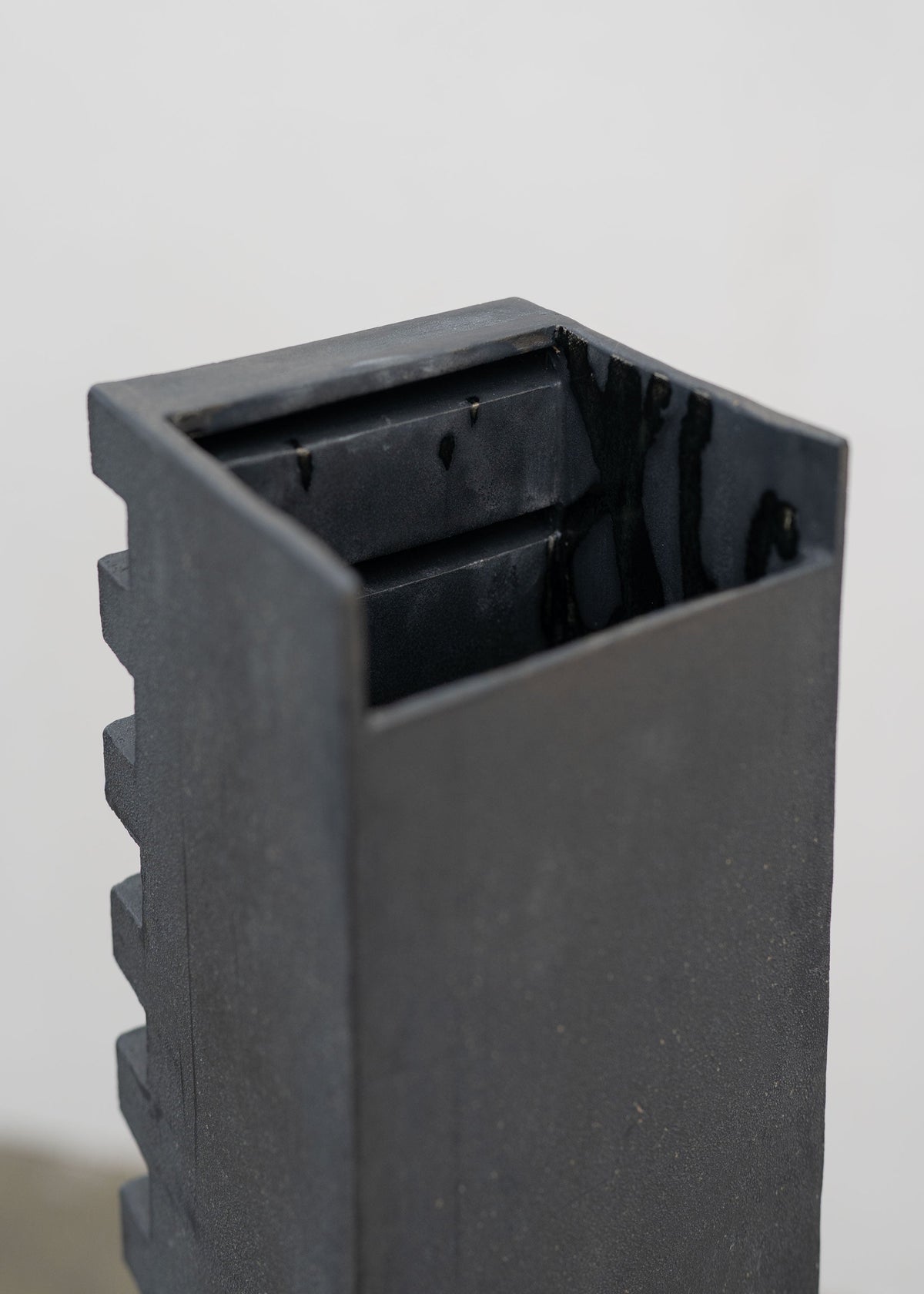 Tall Sculptural Stoneware Vessel by Tom Roberts — close-up of textured black surface