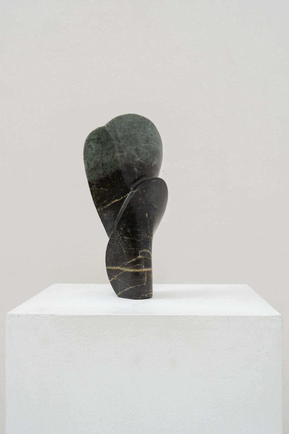 Abstract green marble sculpture with curved organic forms by Tom Bogle