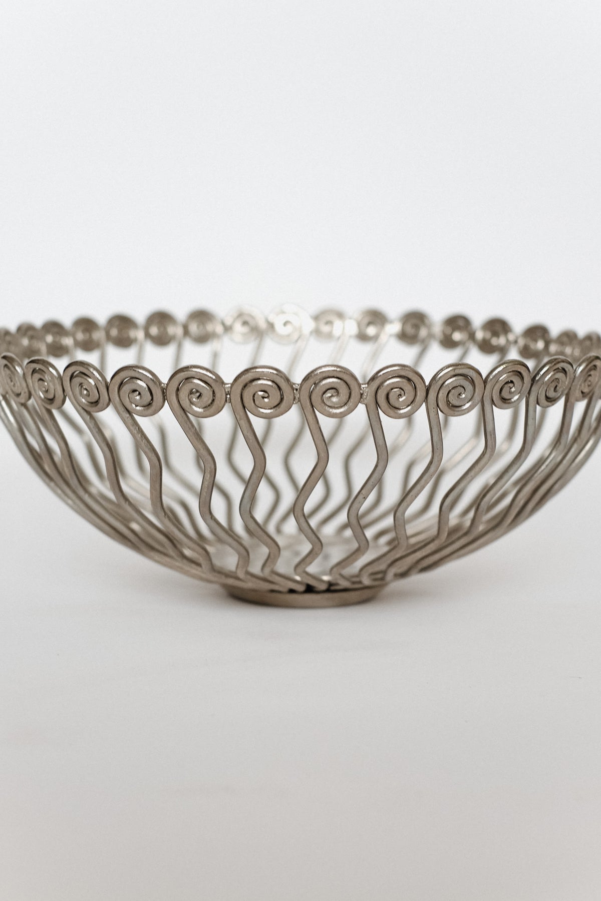 Large Decorative Bowl — back view of twisted metal design