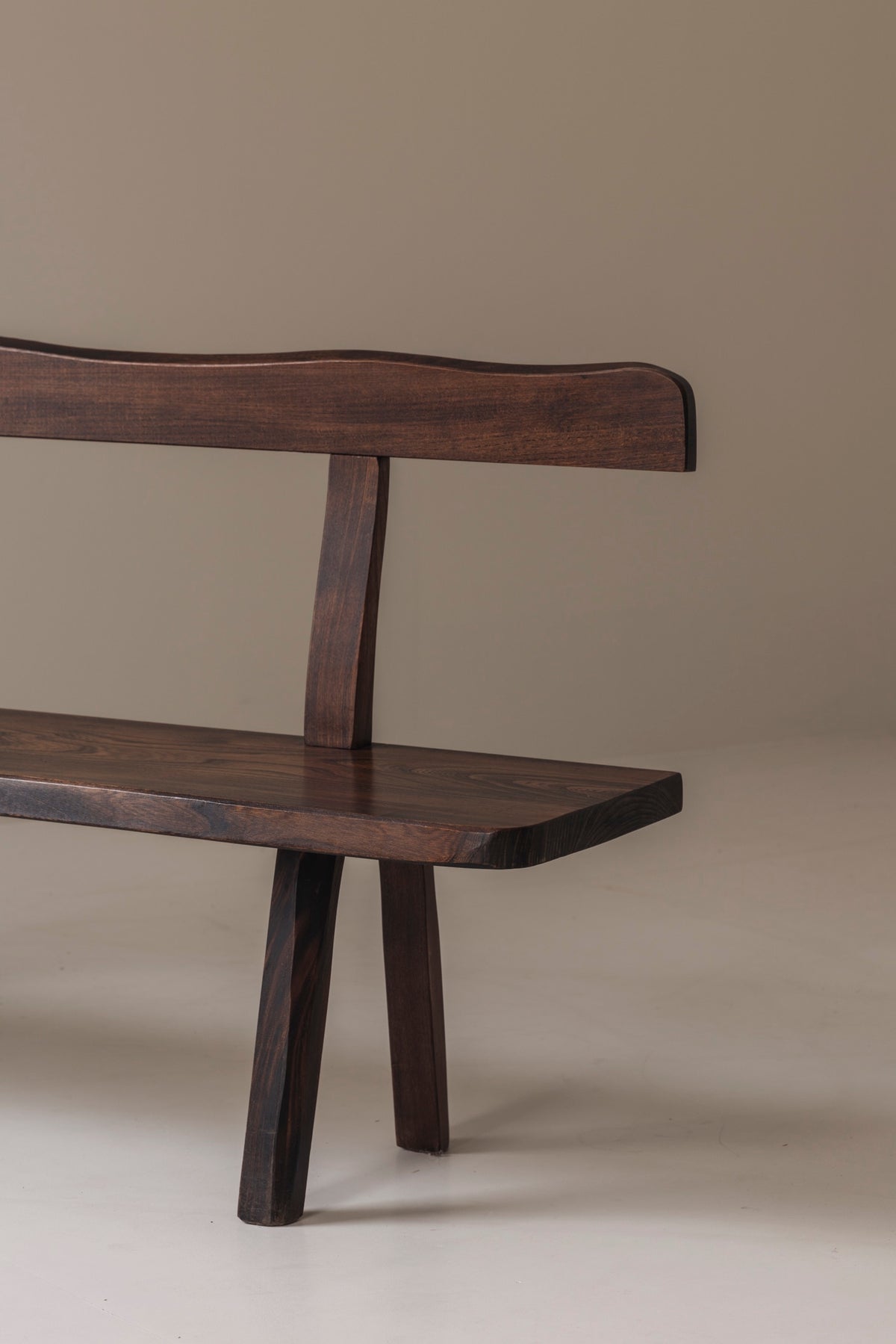 Sculptural Bench by Olavi Hanninen for Aranjou, France 1950s — angled view of dark wood seat and backrest