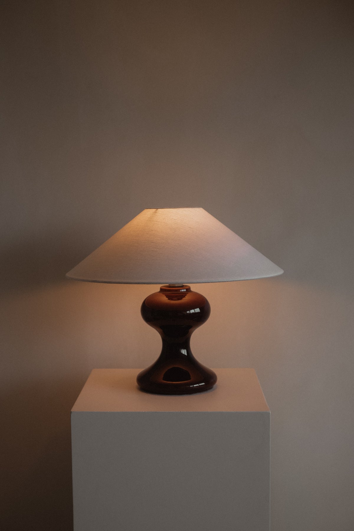 The Cordovan Hourglass Ceramic Table Lamp — side angle